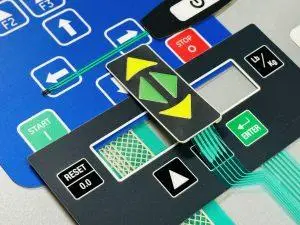 Custom membrane switch assembly with tactile overlay, circuit layers, and precision button cutouts for industrial control equipment.