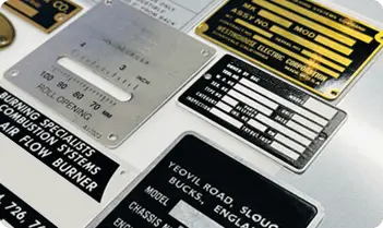 Custom industrial nameplate showing model number, voltage, and safety rating.