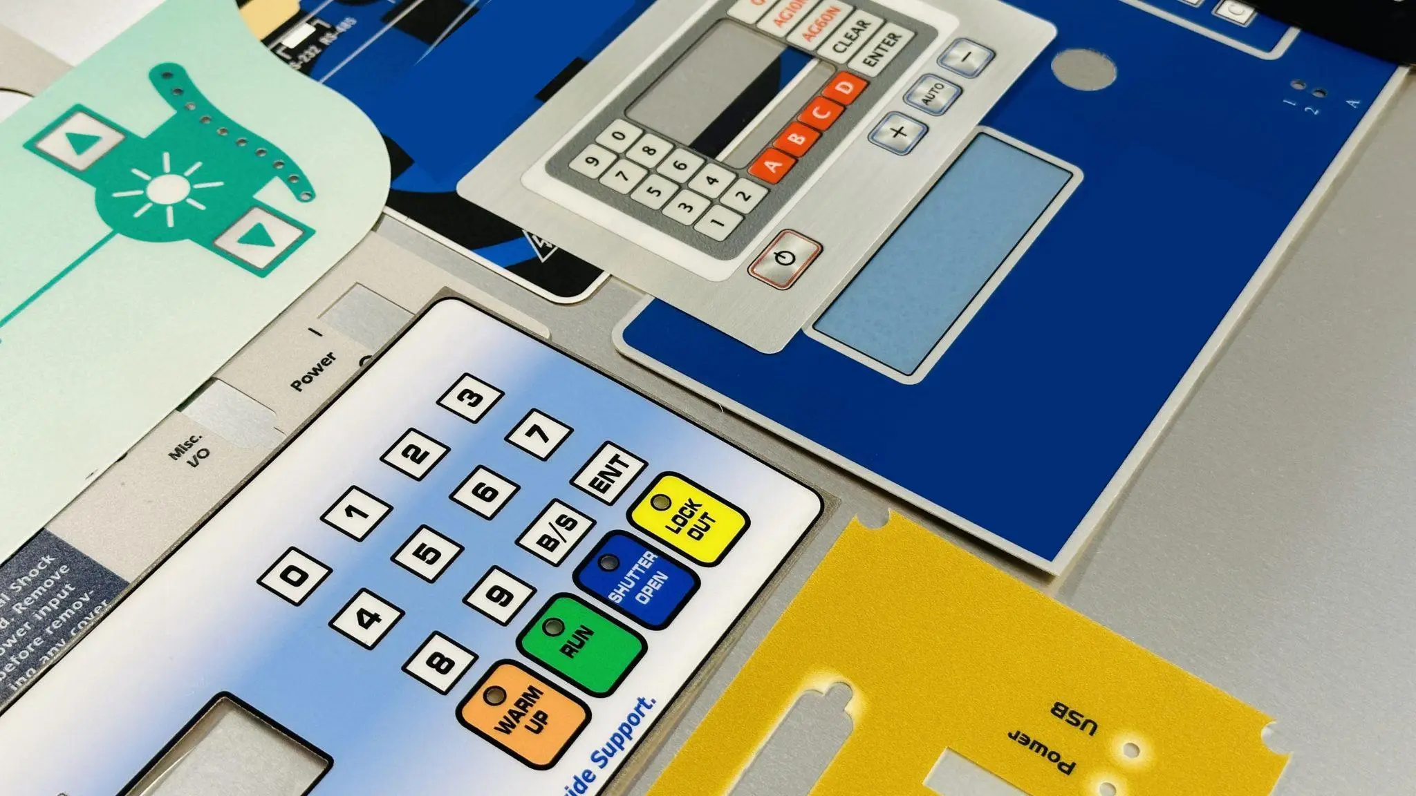 Custom-printed graphic overlay with branded button labeling.