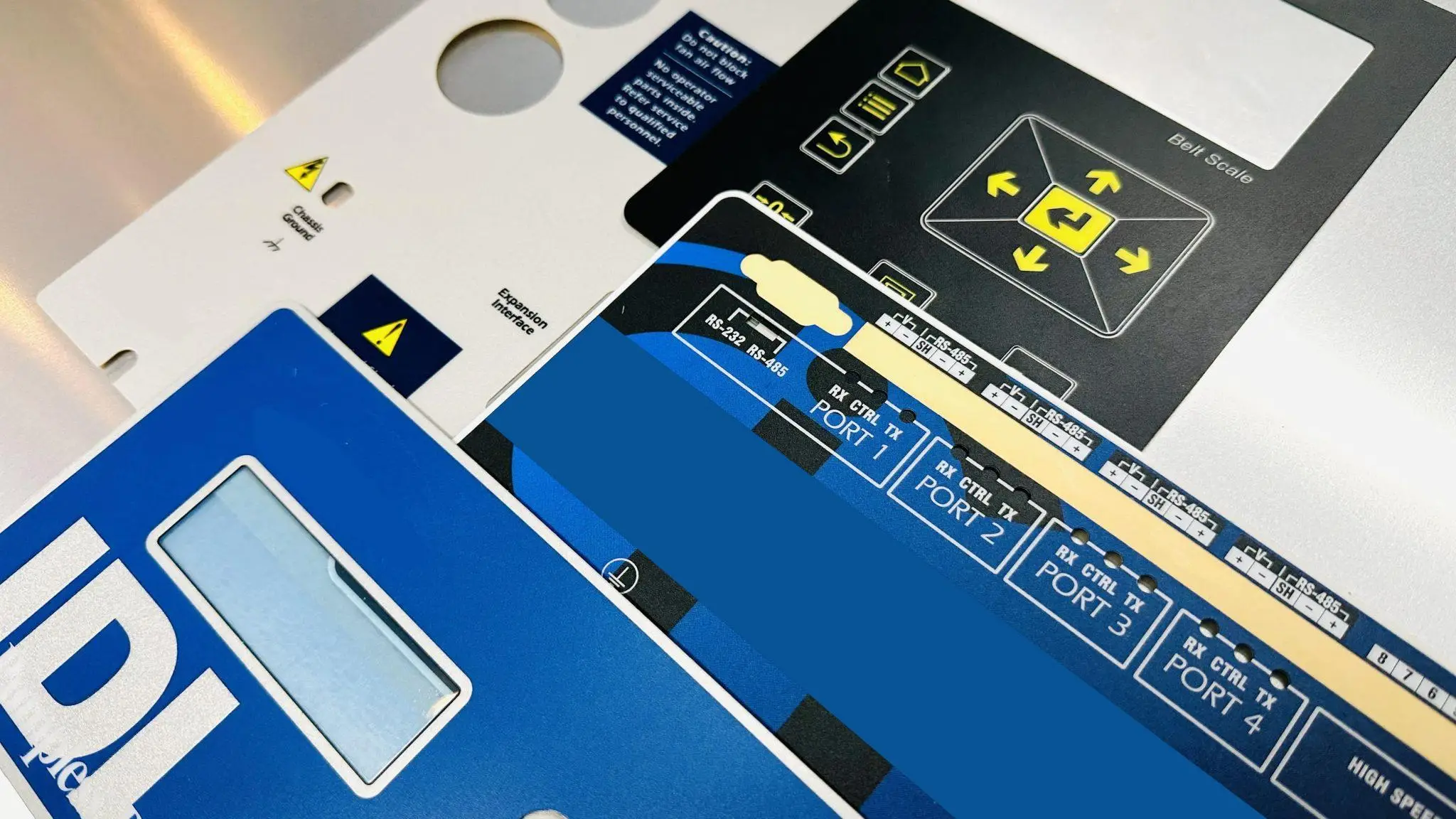 Polycarbonate graphic overlay with durable matte finish.