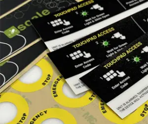 Custom durable labels with control instructions and emergency stop indicators for equipment safety and operator guidance.
