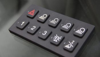 Backlit elastomer keypad with silicone rubber keys for vehicle panels, produced by hayward ca based manufacturer.