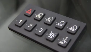 Elastomer keypad with tactile multi-color buttons for medical and industrial device user controls.
