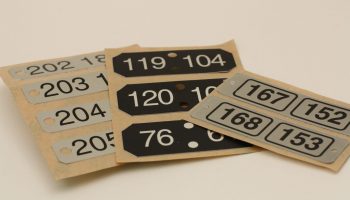 Sequentially numbered aluminum labels for asset tracking and product identification, manufactured near San Jose, California.