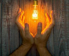 Energy industry innovation symbolized by illuminated bulb, representing durable and compliant labeling solutions from Melrose